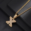 Macro detail of iced out gold plated letter X pendant necklace with sparkling zircons - Letter X / Rope Chain Necklace / Gold