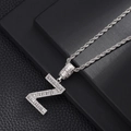 Macro shot of silver baguette-cut zircon encrusted letter Z pendant on a rope chain - Letter Z
