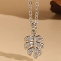 Silver leaf pendant necklace with zircon stones on a thin cross chain for women - Monstera Leaf / Platinum Color