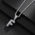 Macro shot of silver bubble letter F pendant with pavé cubic zirconia on rope chain - Letter F (20inch Silver Rope Chain)