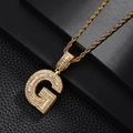 Macro detail of iced-out gold letter G pendant with baguette cubic zirconia stones - Letter G Style