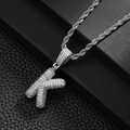 Detail view of iced out silver letter K pendant with cubic zirconia on rope chain - Letter K (20inch Silver Rope Chain)