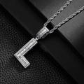 Detailed close-up of a silver letter L pendant with micro-pave cubic zirconia on rope chain - Letter L