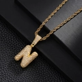 Detailed macro view of 3D letter N pendant with white zircons on golden twist rope chain - Letter N Style
