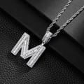 Close-up of hip hop square letter M pendant with baguette-cut and micro-pave crystals - Letter M
