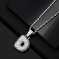 Macro detail of silver iced-out bubble letter d pendant with shiny zircon pavé and rope chain - Letter D / Silver