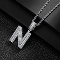Detailed view of silver N-letter pendant with pave-set crystals and thick twist rope chain - Letter N