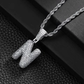 Macro shot of silver hip-hop letter N pendant with pavé zircon on a rope chain - Letter N (20inch Silver Rope Chain)