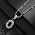 Close-up of iced out letter O pendant with sparkling stones on silver rope chain - Letter O (20inch Silver Rope Chain)