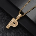 Macro shot of gold-plated letter P pendant with zircon inlay on a twisted rope chain - Letter P Style
