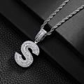 Macro shot of silver S letter pendant with baguette zircons on a classic rope chain - Letter S