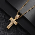 Macro view of gold plated cross pendant with cubic zirconia on black leather - Letter T Style