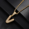 Close-up of golden letter V pendant with pavé cubic zirconia and twisted rope chain - Style Letter V