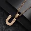 Close-up of gold-plated letter U pendant necklace with micro-pave cubic zirconia crystals - Letter U Style