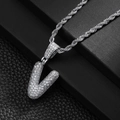 Macro shot of a silver V-letter pendant with pavé-set zircons on a silver rope chain - Letter V (20inch Silver Rope Chain)