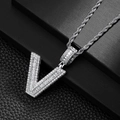 Close-up of hip hop silver V-pendant necklace with baguette and round cubic zirconia stones - Letter V