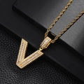Detailed close-up of golden letter V pendant with cubic zirconia on black leather - Style Letter V