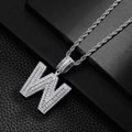 Close-up of hip hop silver W letter pendant with cubic zirconia on a rope chain - Letter W