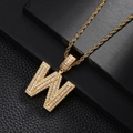 Macro shot of gold-plated W letter pendant with sparkling cubic zirconia on rope chain - Letter W Style