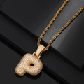 Close-up of golden rope chain necklace with 3D letter P pendant encrusted in zircons - Letter P / Gold