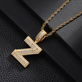 Close-up of iced out letter N pendant with pavé cubic zirconia on golden rope chain - Letter Z Style