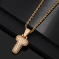 Macro view of gold-plated letter T pendant with sparkling cubic zirconia on rope chain - Letter T / Gold