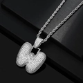 Macro detail of silver hip hop W letter pendant with sparkling zircon paving on rope chain - Letter W / Silver