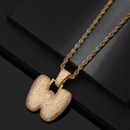 Close-up of gold-plated bubble letter W pendant with micro-pave zircons and rope chain - Letter W / Gold