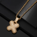 Close-up of a gold-plated iced out cross pendant with sparkling white cubic zirconia stones - Letter X / Gold