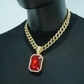 Macro detail of iced-out cuban chain with emerald-cut red crystal hip hop pendant - Pave Cuban Link / Gold Red Artificial Gemstone With Necklace