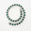 Macro detail of hip hop tennis chain featuring square green stones with white zircon halo - 7inch(18cm) / Silver