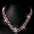 Cuban link necklace with red and white rhinestones on black display bust - Silver And Orange Red Necklace
