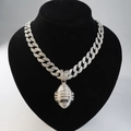 Macro shot of silver Cuban link necklace with a diamond-encrusted football pendant - Silver Pendant + 18-inch Necklace