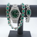 Close-up of silver watch set with emerald green gems on black display stand - Silver Green Style