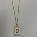Gold letter D pendant necklace with white enamel inlay and shimmering zircon stones - Letter D