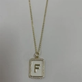 Gold pendant necklace with white enamel and letter F zircon pave rectangular charm - Letter F