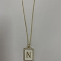 Gold plated necklace with white enamel rectangle pendant featuring a zircon letter N charm - Letter N