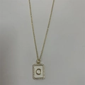 Golden necklace with a rectangular enamel letter O pendant surrounded by shiny zircon stones - Letter O