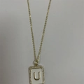 Gold letter U necklace with white enamel rectangle pendant and zircon border - Letter U