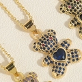 Macro shot of bear pendants with colorful crystals and heart-shaped blue stones - Royal Blue Heart Bear