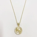 Macro view of 14K gold plated Capricorn zodiac pendant necklace with white zircon stones - Aries / Gold