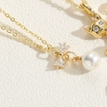 Detail of gold-plated necklaces featuring a zircon cat pendant and a bow with pearl drop - Bowknot Artificial Pearl Style (XL2627-MA2-1)