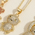 Elegant gold plated necklace with bear pendant featuring sparkling white and black zircons - Zircon Bear