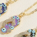 Macro detail of colorful evil eye necklaces with cubic zirconia and gold plating - Purple (XL2649-1)