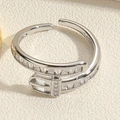 Macro shot of silver buckle ring with rectangular clear zircons on beige leather - Belt Buckle Style