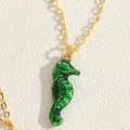 Hawaiian style gold chain necklace with a dark green seahorse oil drip pendant - Green Enamel