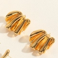 Macro detail of polished gold fan-shaped earrings with textured wavy metal finish - Shiny Gold Fan Pleated Style