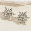 Close-up of golden petal earrings with marquise-cut crystals and floral detailing - Gold Alloy Flower Earrings