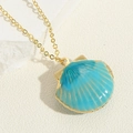 Macro view of blue enamel seashell locket pendant on a gold chain necklace - Scallop Pendant (XL3385-4) / Lake Blue