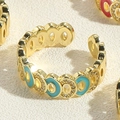 Macro shot of gold adjustable ring with blue enamel and sparkling pavé zircon details - Adjustable Open / Lake Blue